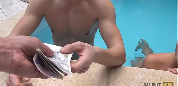 HUNT4K. Slim brunette has sex with stranger by the pool near her man